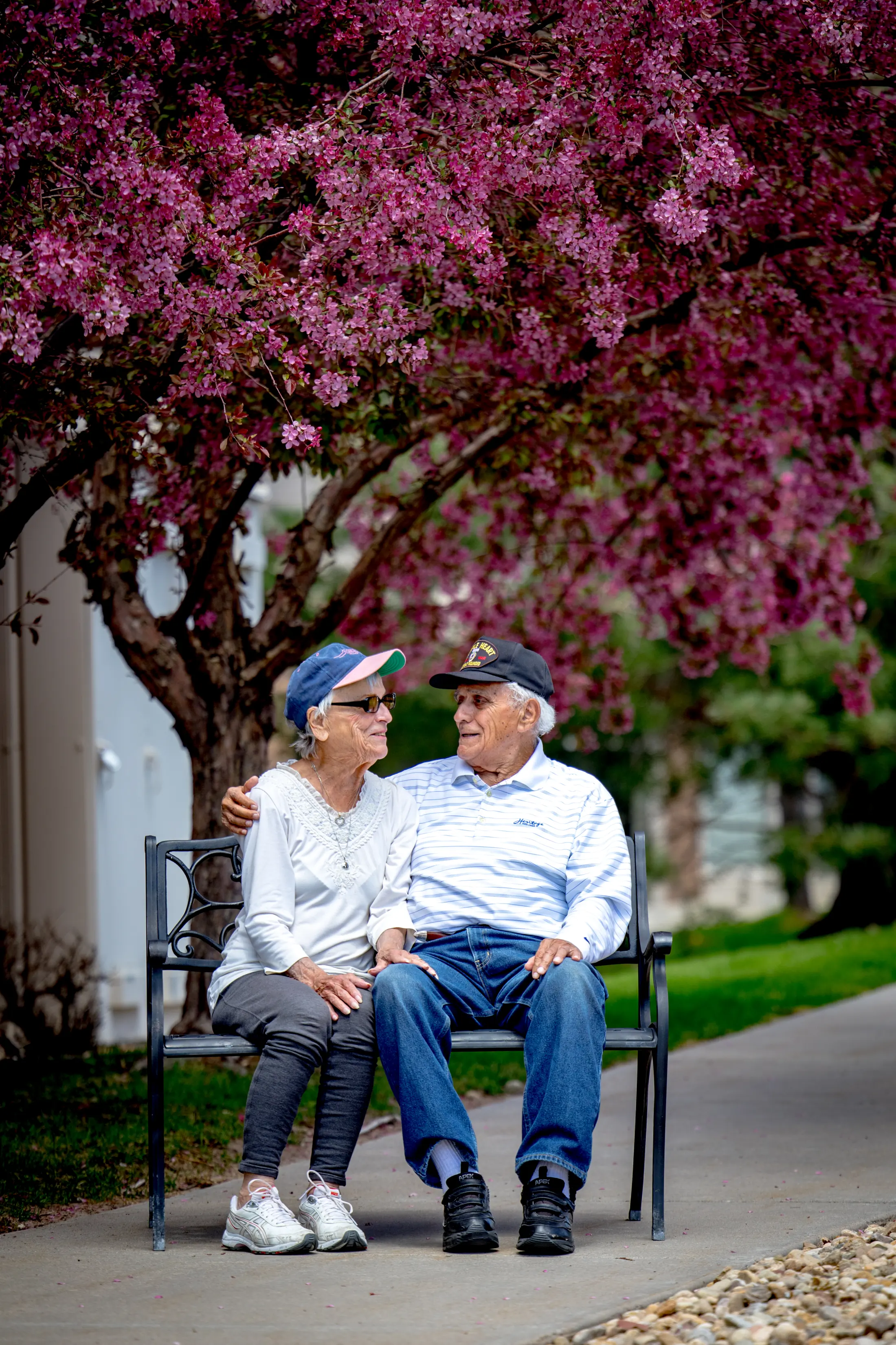 Golden Pond residents relaxing together on a courtyard bench.